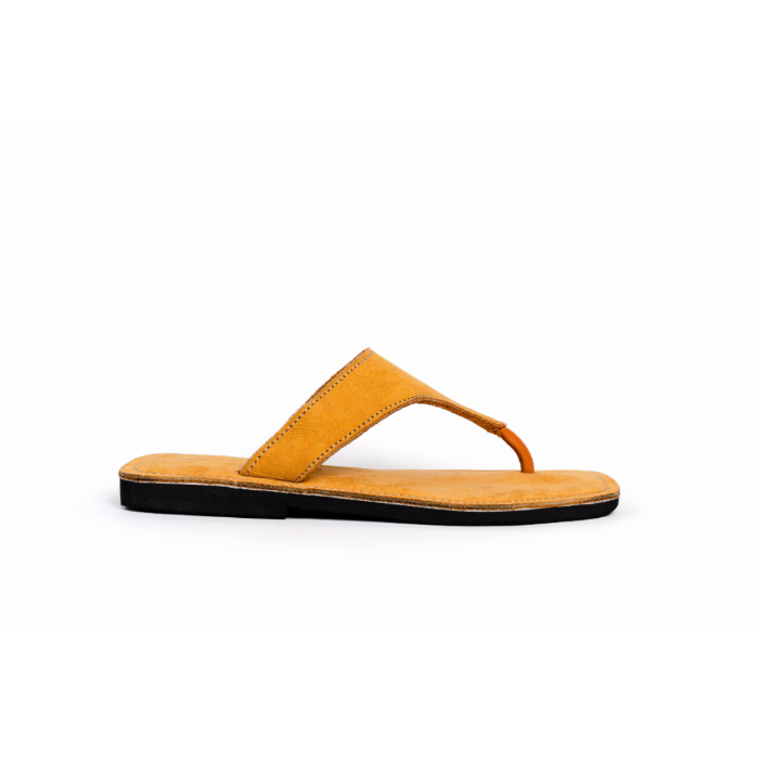 Yellow sandal with a black sole on a white background