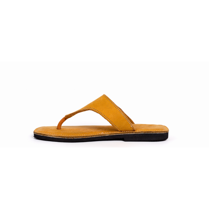 Yellow sandal with a black sole on a white background