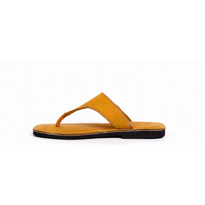 Yellow sandal with a black sole on a white background