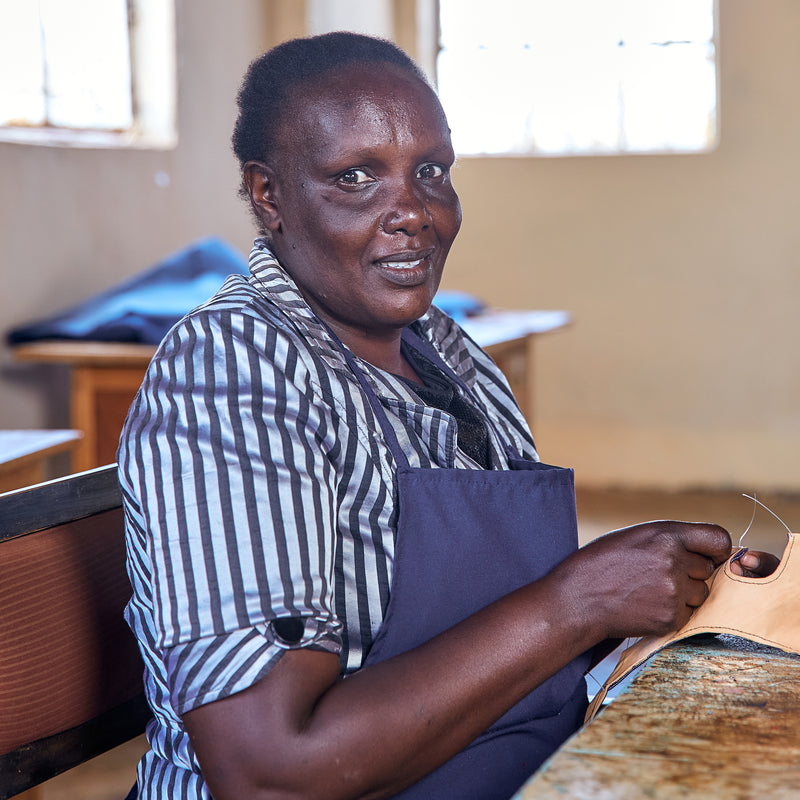 Image of Jepchumba, a quality controller employed by Miriam Bella in Kenya to make leather sandals