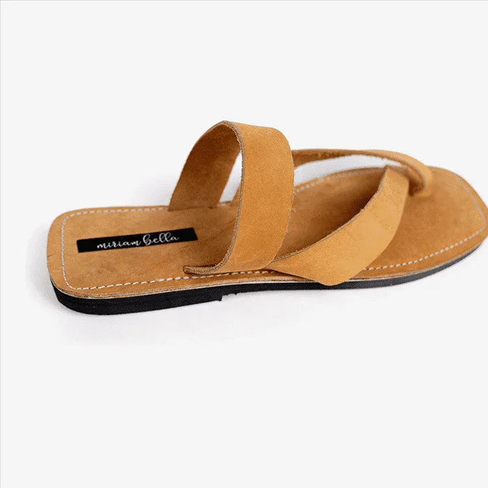 Image of handmade tan leather sandal with cross strap produced by Australian brand Miriam Bella