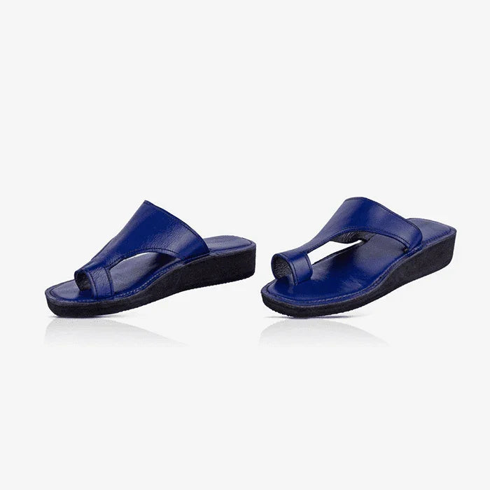 pair of blue leather thong sandals, produced by Australian brand Miriam Bella