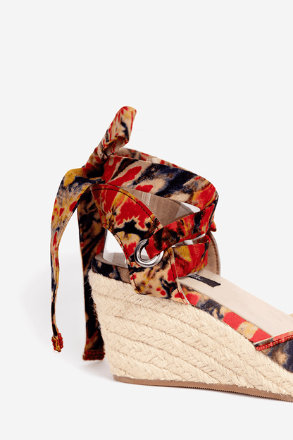 Colorful wedge sandal with floral pattern on a white background