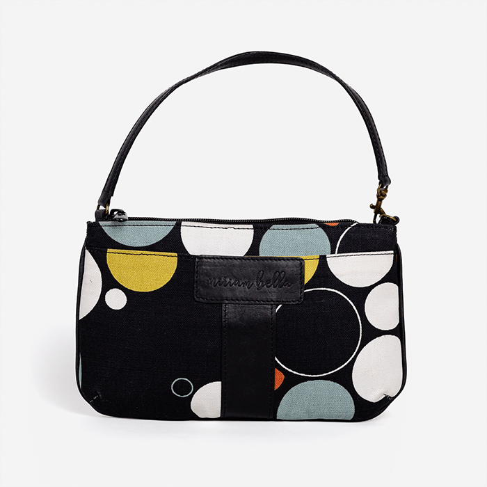 Handbag with geometric pattern on a white background