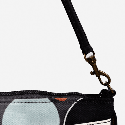 Close-up of a black strap with a metal clasp on a product with a white background