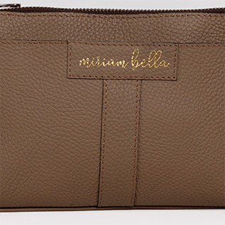 Brown leather pouch with 'Miriamella' branding on a white background