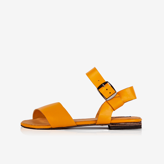 A single Marigold Women’s Leather Ankle Strap Flat Sandal on a white background